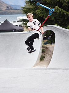 boy doing trick using kick scooter thumbnail