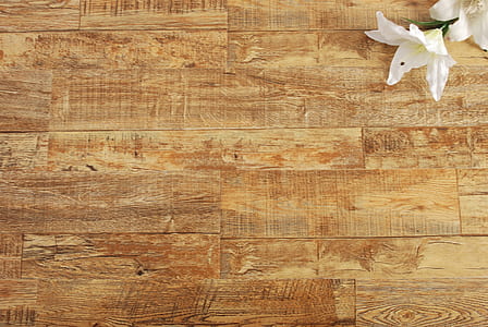 white flowers on brown wooden desk thumbnail