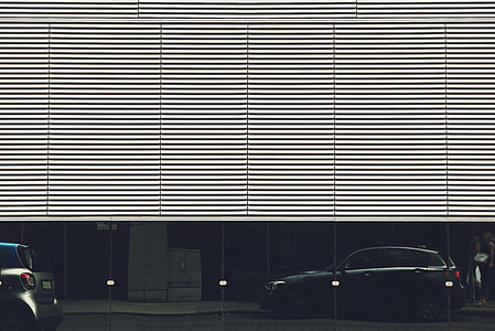 black SUV near half-opened garage gate thumbnail