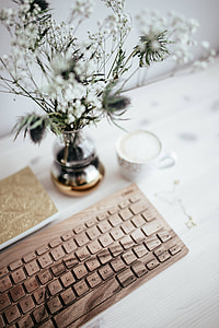 Wooden keyboard and cup of coffee thumbnail