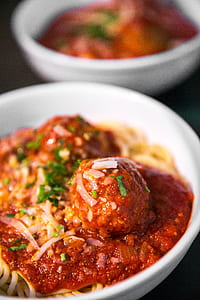 close up photography of pasta with meat balls thumbnail