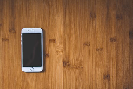 Silver Iphone 6 on Brown Wooden Surface thumbnail