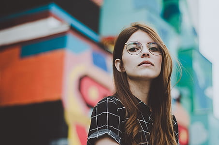 selective focus photo of a woman wearing black and white top thumbnail