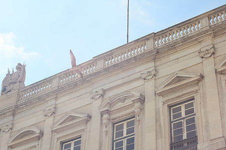low angle photography of beige building thumbnail