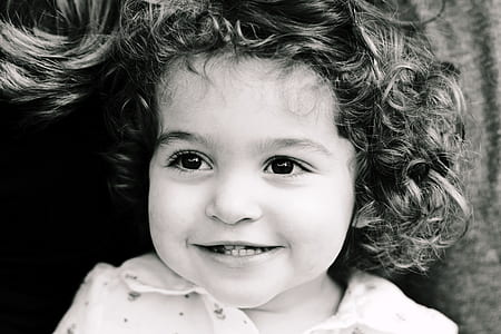 grayscale photo of smiling child thumbnail