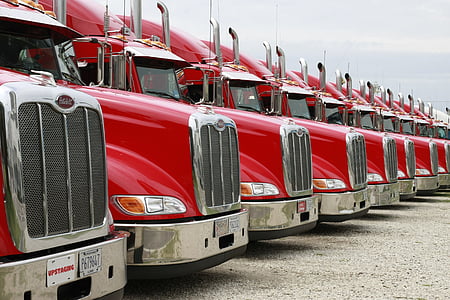 red semi trucks under white sky thumbnail