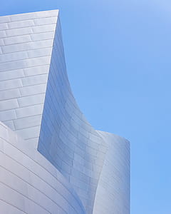 white concrete building under blue sky thumbnail