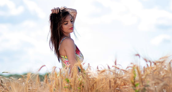 woman in white and green floral maxi dress thumbnail