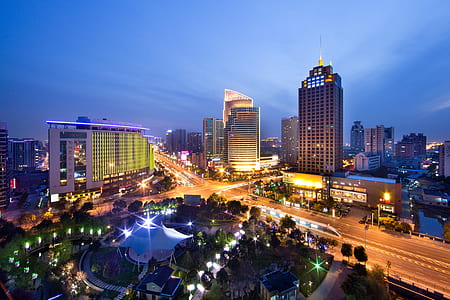 lighted city buildings during nighttime thumbnail