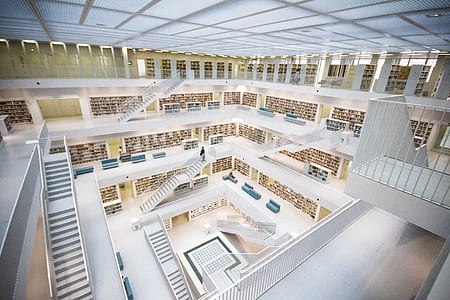 aerial view of white building interior with stairs thumbnail