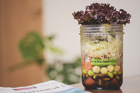 purple, green, and white vegetable in the clear glass jars thumbnail