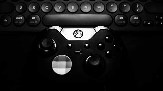Microsoft Xbox One Elite wireless controller next to keyboard thumbnail