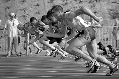 grayscale photo of athletes running in field thumbnail