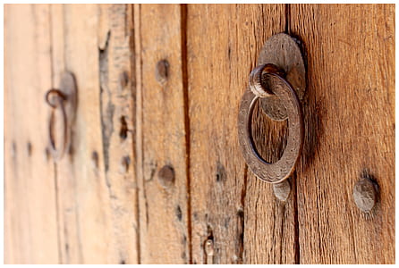 round brown metal door knocker on door thumbnail