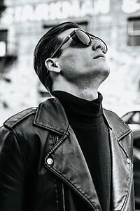 grayscale photo of man looking up thumbnail