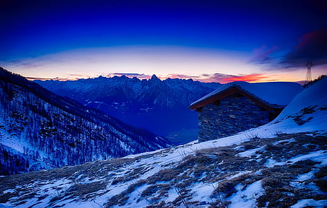 landscape photography of house near mountain thumbnail