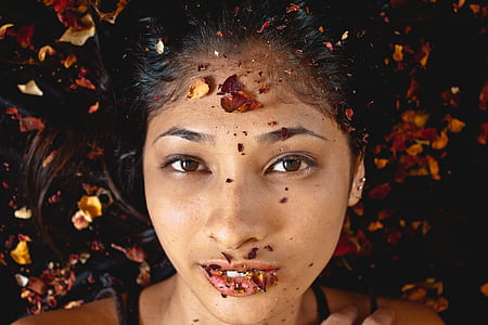Photography of Woman Whose Lying on Dried Leaves thumbnail