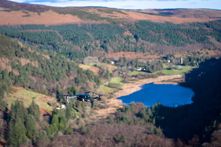 black done flying near lake thumbnail