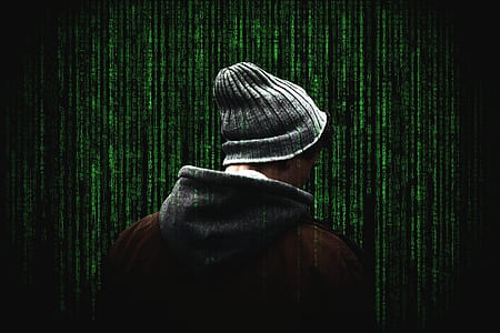 man standing near green wall thumbnail