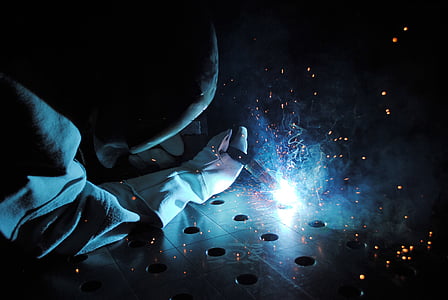 photo of person welding metal thumbnail