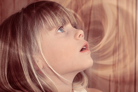 girl standing beside wall thumbnail