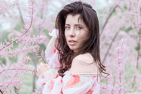 woman in pink floral off-shoulder near the pink flowers thumbnail