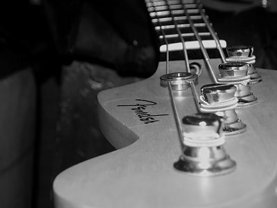 grayscale photography of Fender 4-string bass guitar thumbnail