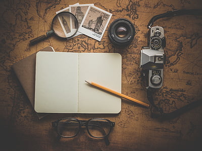 black and gray camera with magnifying glass and pencil thumbnail