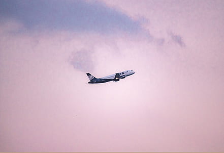 white airplane on sky with white clouds thumbnail