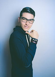 Man in Blue Hooded Jacket and Black Framed Eyeglasses thumbnail