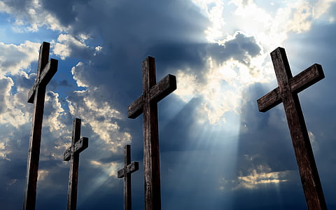 brown wooden cross under blue sky at daytime photo thumbnail