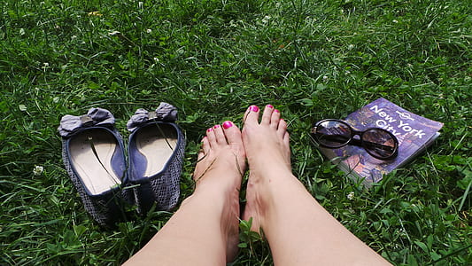 person's feet beside flat shoes thumbnail