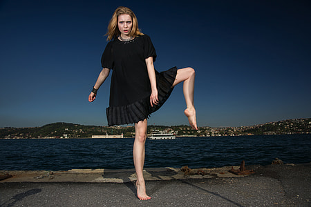 woman wearing black scoop-neck mini-dress thumbnail