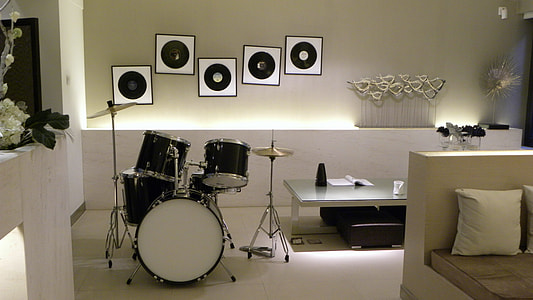 black drum set beside coffee table and sofa thumbnail