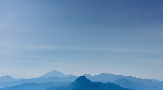 foggy mountain under gray sky thumbnail