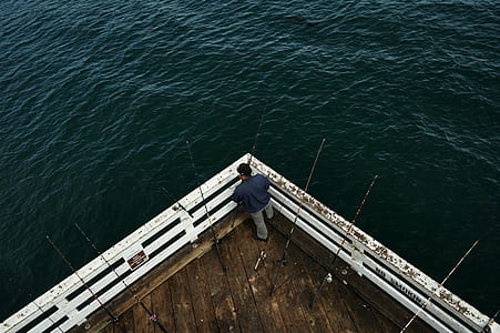 man standing on white ocean deck thumbnail