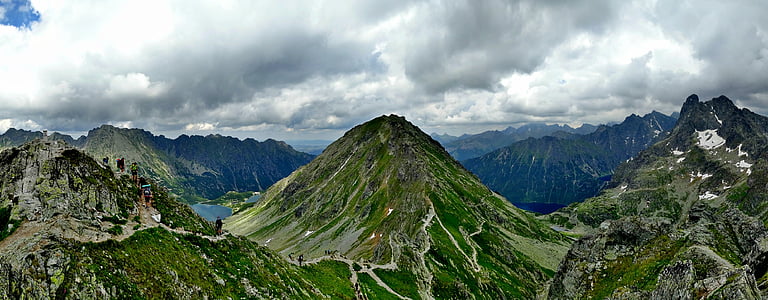 mountain range under nimbus clouds thumbnail