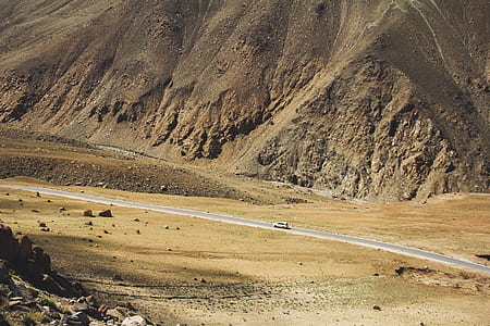 white vehicle on gray asphalt road thumbnail