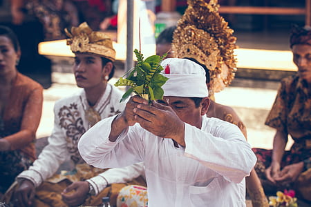 man holding stick with leaves thumbnail