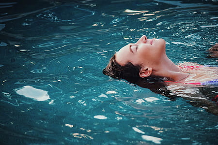 closeup photo of woman in body of water thumbnail