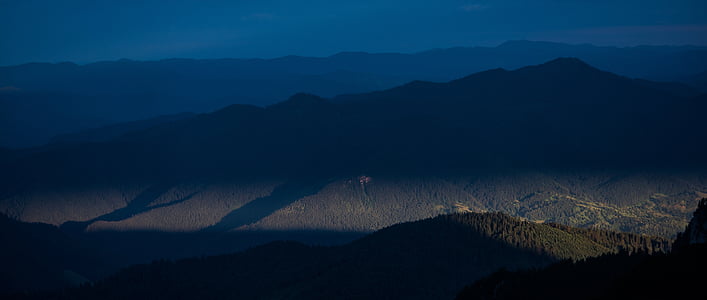 aerial photography of mountain with green leafed tree at daytime thumbnail