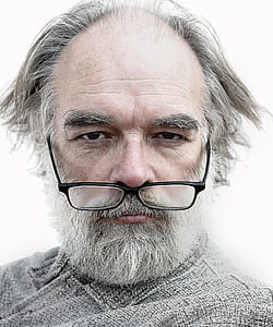 man wearing black framed eyeglasses with white beard thumbnail