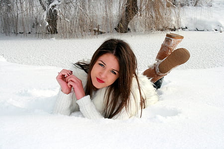 woman wearing white winter coat posing at camera thumbnail