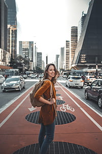 woman smiling in the middle of road thumbnail