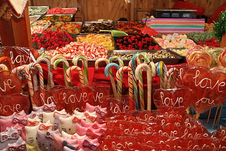 blue, red, and white candy canes near lollipops thumbnail