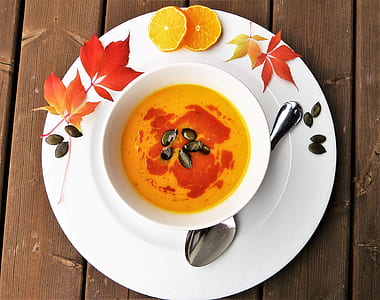yellow soup on ceramic bowl thumbnail