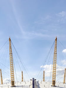 brown truss towers during daytime thumbnail