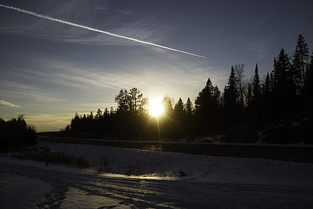 Sunset over the trees at Gooseberry Falls State Park, Minnesota thumbnail