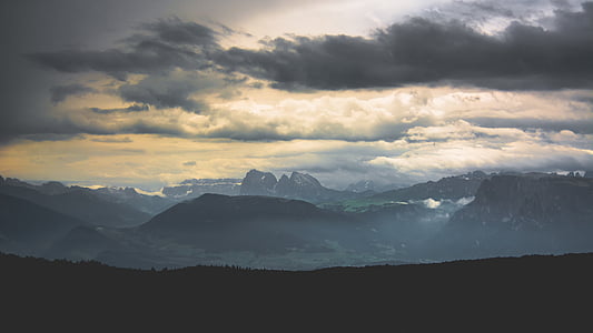 mountains under cloudy sky thumbnail