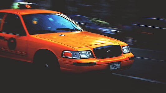 closeup photo of orange Ford vehicle thumbnail